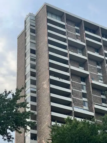 Concrete and brick reaching for the clouds.